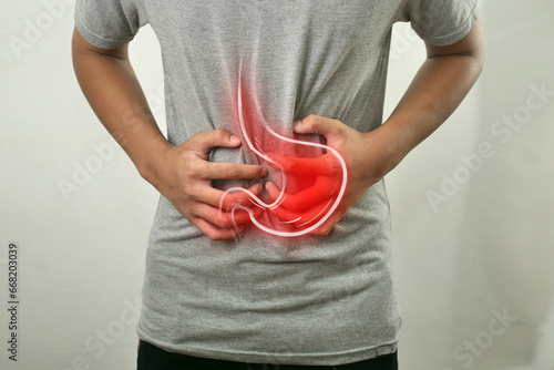 Digital composition of internal gastric with highlighted red inflammation on sick person, man with stomach pain gastritis, health and medical