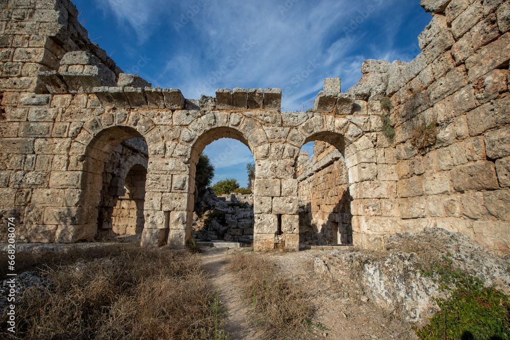 Scenic ruins of the nymphaeum (nymphaion) in Perge (Perga) at Antalya Province, Turkey. Awesome view of the ancient Greek city. Perge is a popular tourist destination in Turkey.