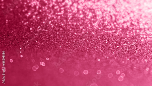 Viva Magenta sparkling festive background. 2023 color of the year glitter background, selective focus, blur effect