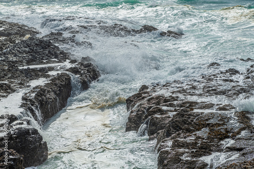 Large waves crush the coastline near Porto Covo, Portugal photo