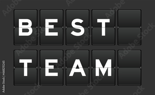 Black color analog flip board with word best team on gray background