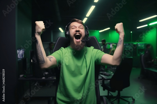 Professional eSports male gamer rejoices in the victory in green gaming room generative ai photo