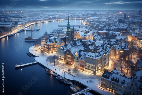 Aerial photography of Nyhavn, copenhagen in snowy winter, beautiful architecture, stunning view, city lights  at blue hour photo