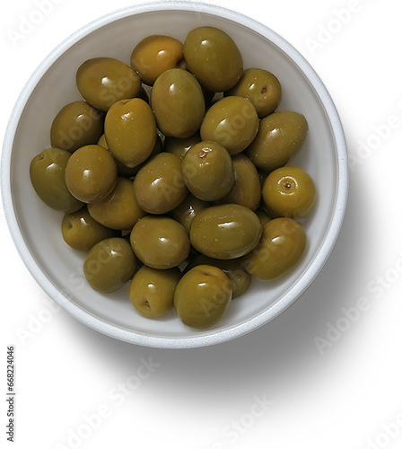 Top up view white ceramic bowl with green olives.