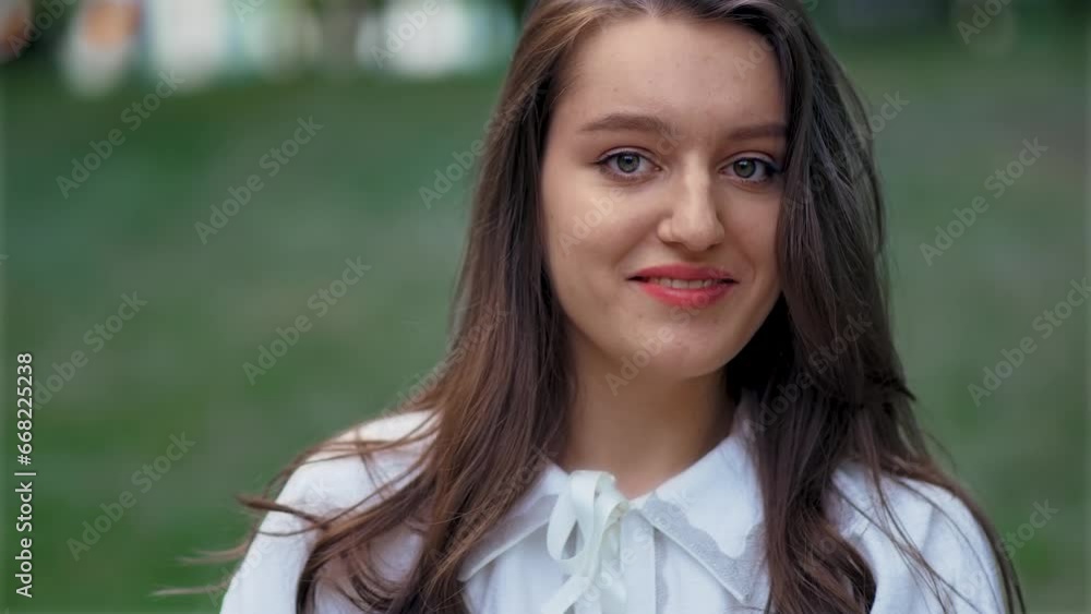 Portrait happy cheerful woman in public park looking at camera and smiling. Relax leisure activity, active lifestyle, cheerful confident attractive girl Portrait happy cheerful woman in public park looking at camera and smiling. Relax leisure activity, active lifestyle, cheerful confident attractive girl