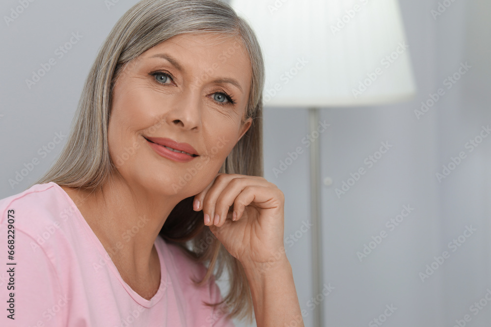 Portrait of beautiful senior woman at home. Space for text Portrait of beautiful senior woman at home. Space for text