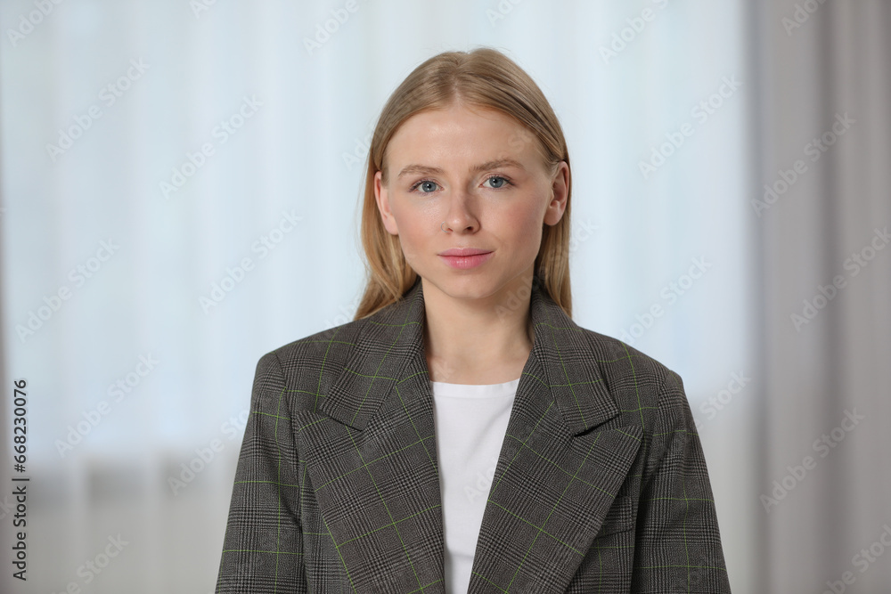 Portrait of beautiful young woman in stylish jacket indoors Portrait of beautiful young woman in stylish jacket indoors