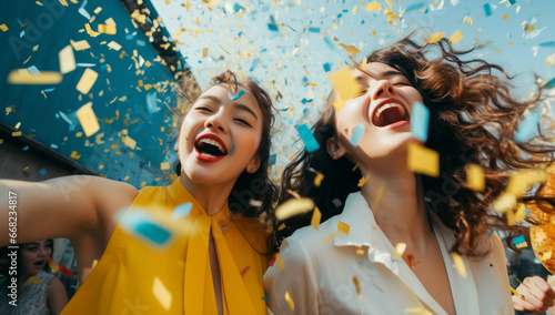  two women together with confetti photo