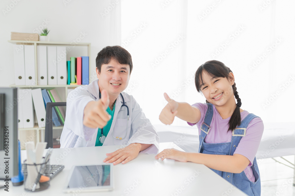 asian doctor and children patient show thumb up sign with hands together, happiness and relationship in hospital, they feeling happy and smile asian doctor and children patient show thumb up sign with hands together, happiness and relationship in hospital, they feeling happy and smile