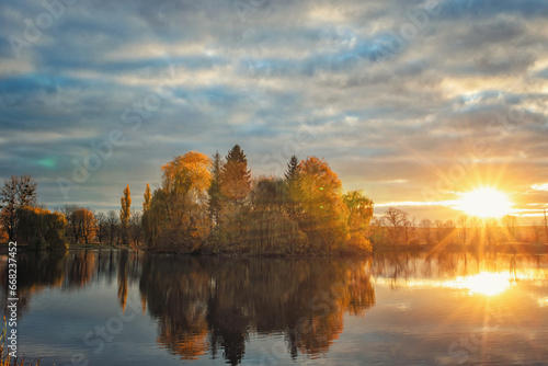 sunset over the lake © Evgenii