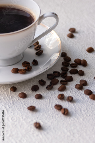 white cup of coffee with beans