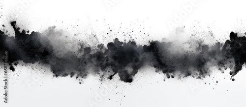 Charcoal particles pollute white background