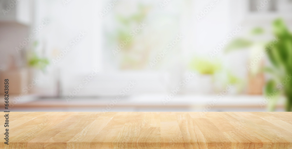 Selective focus.Wood table top on blur kitchen counter background. Selective focus.Wood table top on blur kitchen counter background.