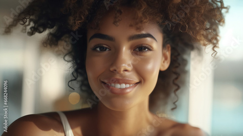 Smiling young woman with cu...
