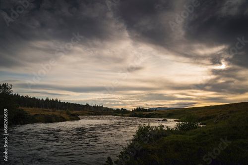 An autumnal dusk HDR image of the River Naver  known as a salmon river  and the Naver Forest in Strathnaver  Sutherland  Scotland