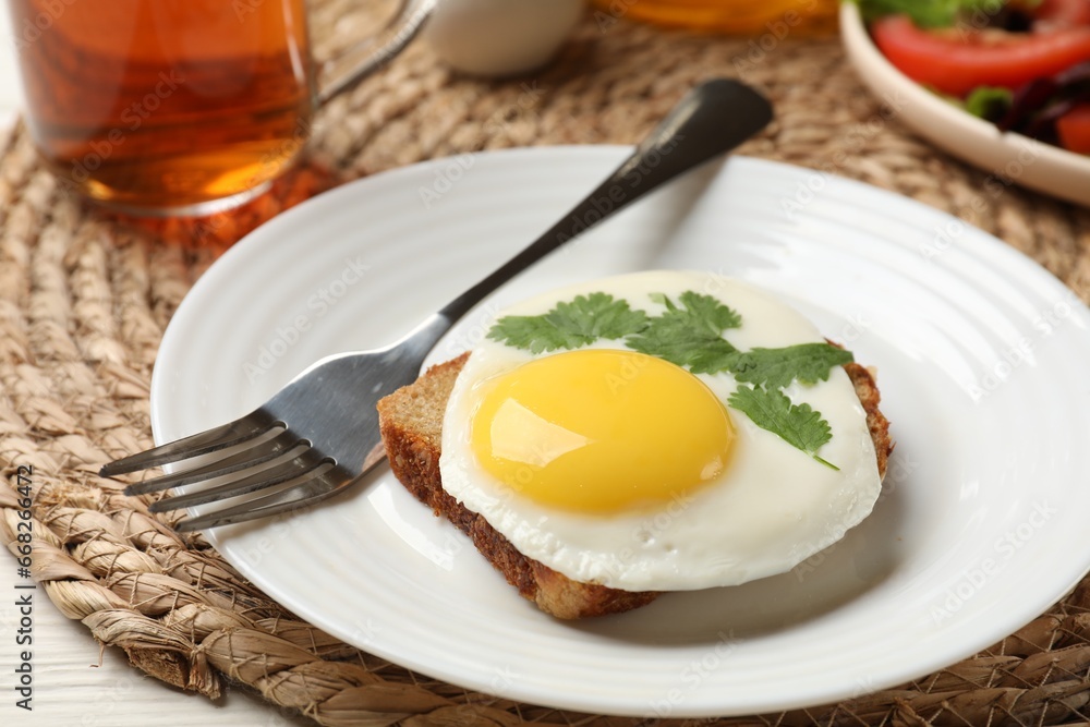 Delicious breakfast with fried egg served on table, closeup Delicious breakfast with fried egg served on table, closeup