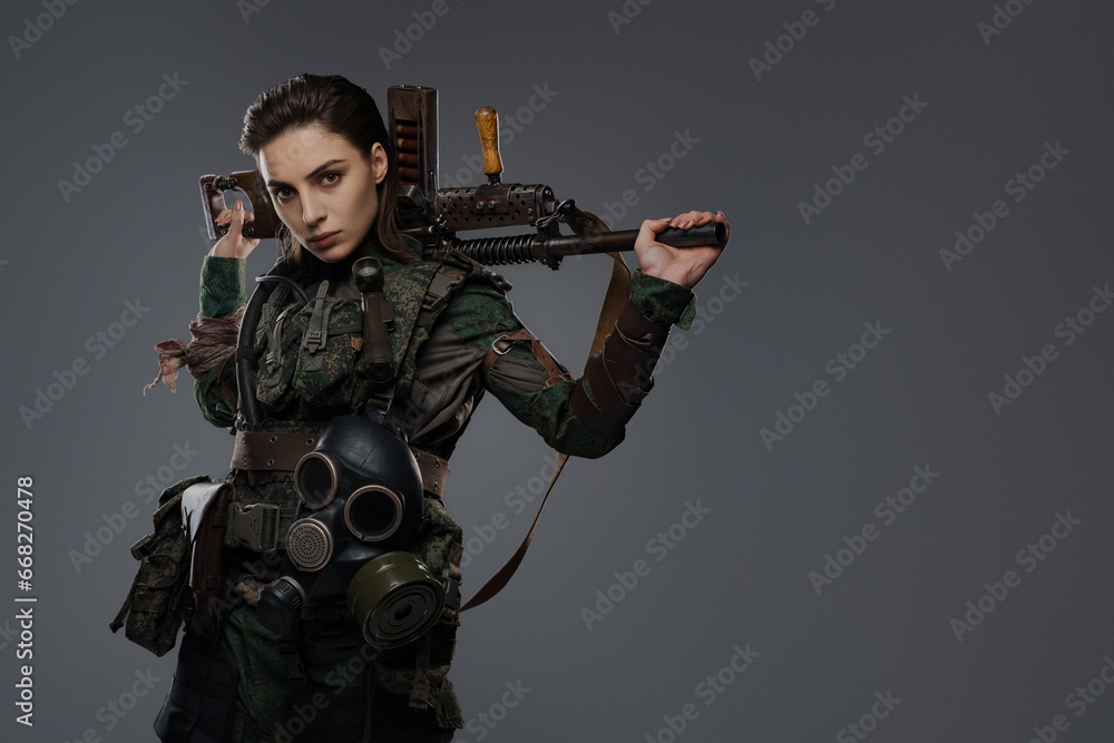 Portrait of a female soldier in military attire, holding a homemade ...