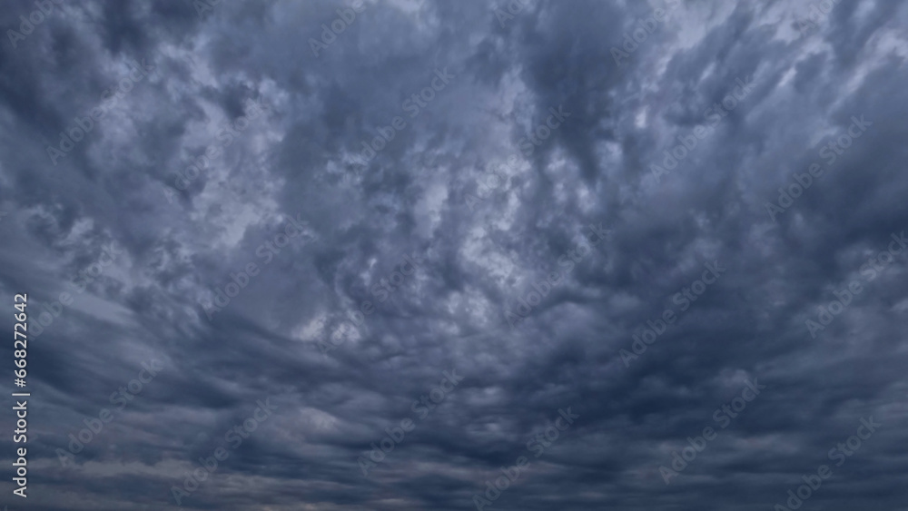 Fototapeta premium pretty skyscape of sky with massive rain or snow clouds backdrop - photo of nature