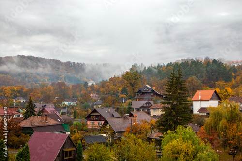 Fog over the village on an autumn morning. Idyllic countryside landscape in Eastern Europe