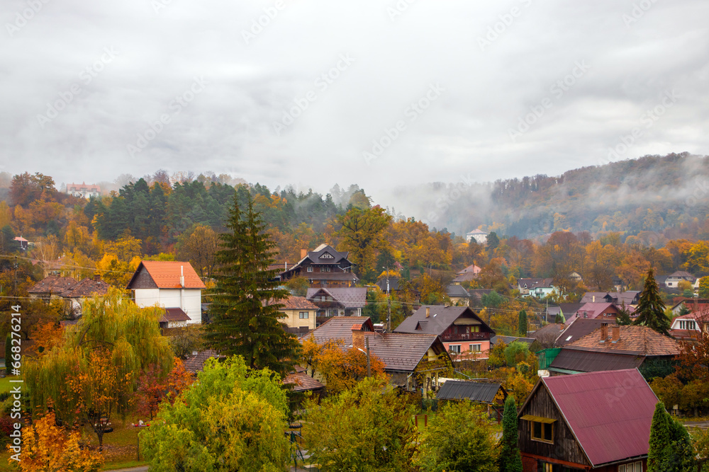 Autumn morning in a rural area. Fog over the village after the rain