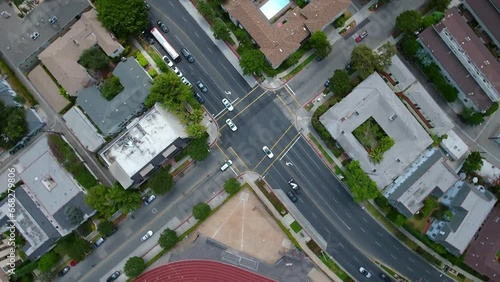 Aerial Top Panning View Of Traffic On Streets Amidst Buildings In City - Beverly Hills, California