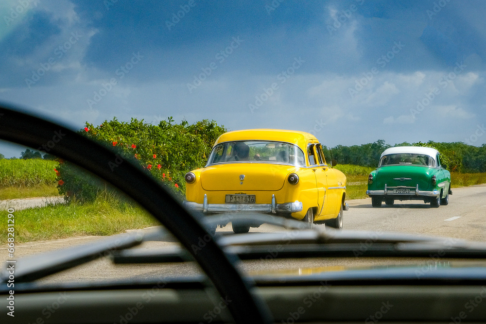 Classic Cars driving in Cuba