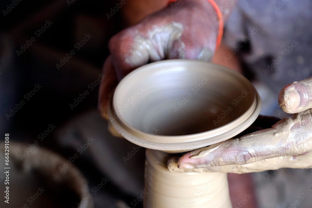 26 October 2023, Pune, India, Indian potter making Diya (oil lamps) or earthen lamps for Diwali Festival with clay, Handwork craft. 26 October 2023, Pune, India, Indian potter making Diya (oil lamps) or earthen lamps for Diwali Festival with clay, Handwork craft.