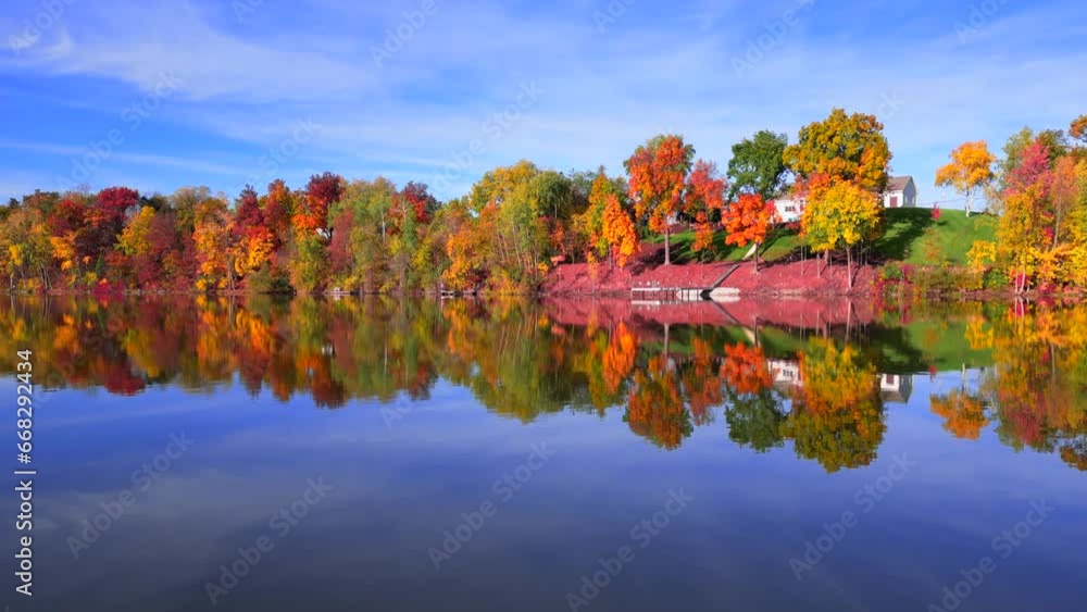 Amazing peak Fall colors by the riverside mid October in Wisconsin, moving aerial view.
Amazing peak Fall colors by the riverside mid October in Wisconsin, moving aerial view.