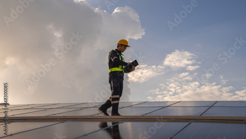 Techniques checking solar cell on the roof for maintenance. Service engineer worker install solar panel. Clean energy concept..