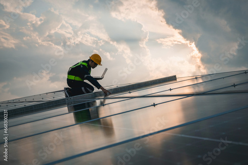 Techniques checking solar cell on the roof for maintenance. Service engineer worker install solar panel. Clean energy concept..