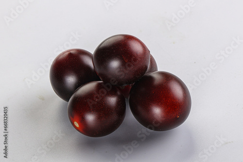 Raw ripe black kumato tomato