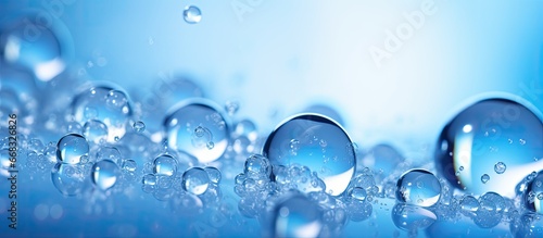 Macroscopic view of levitating transparent blue gas bubbles with defocus bokeh blur representing invigorating cleanliness and vitality