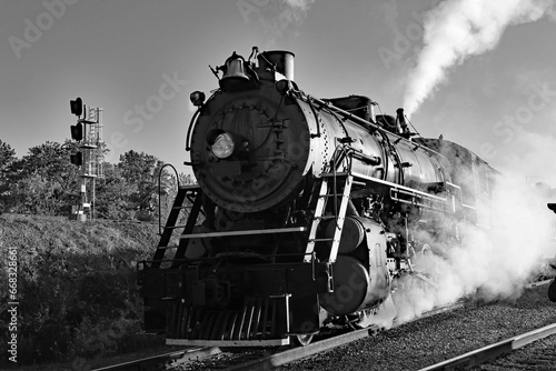 Black and white of the front of a steam and coal locomotive