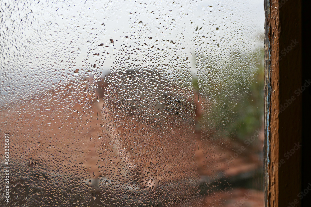 raindrops on the window of a house