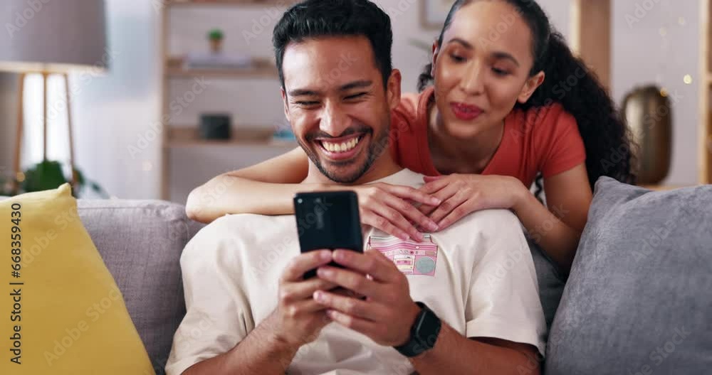 Happy couple, hug and smartphone with man and woman at home, laughing together with social media and communication. Funny meme, love and care in relationship with fun, technology and mobile app Happy couple, hug and smartphone with man and woman at home, laughing together with social media and communication. Funny meme, love and care in relationship with fun, technology and mobile app