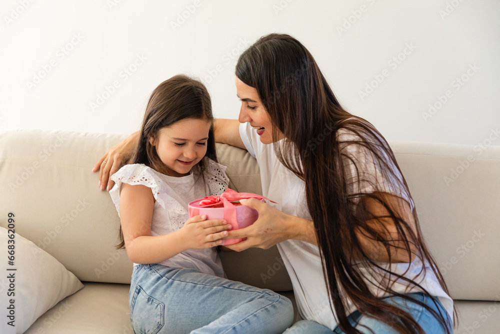 Loving young mother congratulate excited small daughter with birthday give wrapped gift. Caring happy mom greeting make surprise with present for little girl child, celebrate together. Loving young mother congratulate excited small daughter with birthday give wrapped gift. Caring happy mom greeting make surprise with present for little girl child, celebrate together.