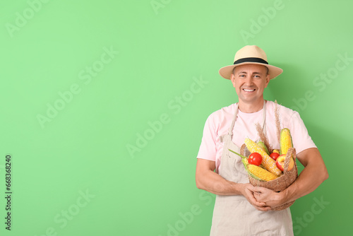 Smiling male farmer in stra...