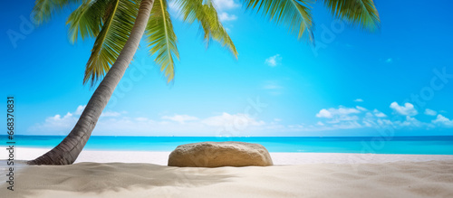 Fototapeta Naklejka Na Ścianę i Meble -  Tropical beach with fine sand, some palms near, calm sea with clear sky above. Stone podium - empty copy space template for vacation or holiday product. Generative AI