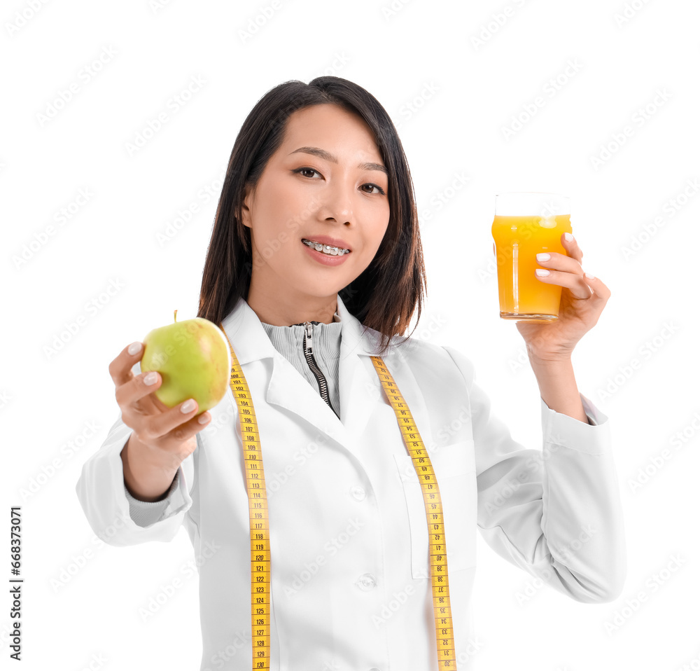 Female Asian nutritionist with apple and juice on white background Female Asian nutritionist with apple and juice on white background