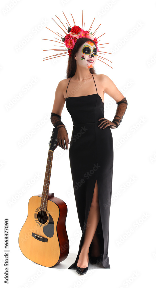 Young woman with painted skull and guitar on white background. Mexico's Day of the Dead (El Dia de Muertos) celebration Young woman with painted skull and guitar on white background. Mexico's Day of the Dead (El Dia de Muertos) celebration
