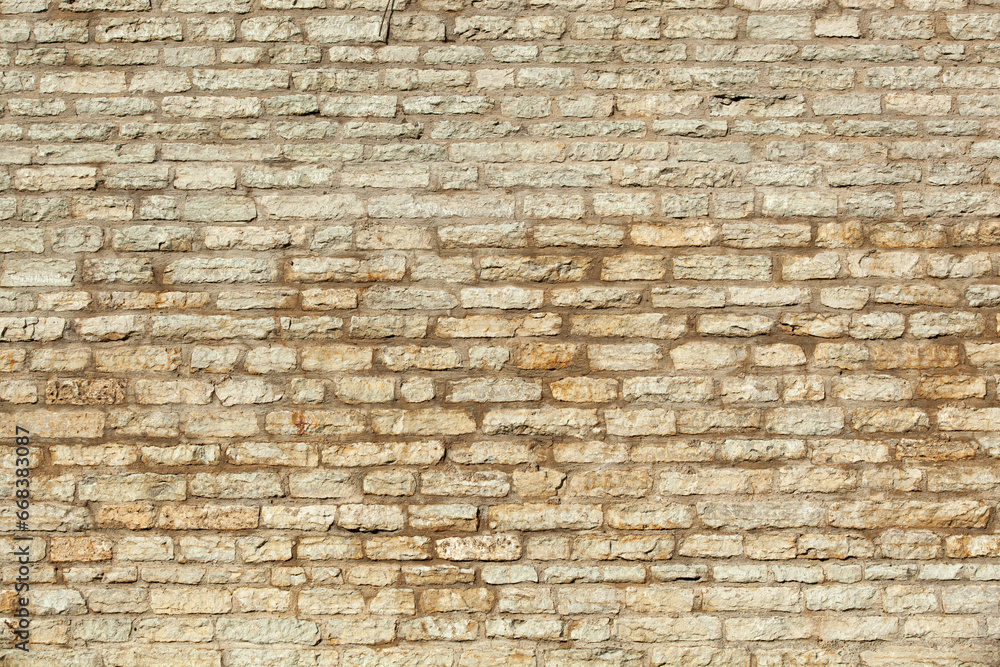 An ancient wall made of gray old bricks in Tallinn. Texture An ancient wall made of gray old bricks in Tallinn. Texture