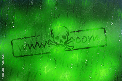 Canvas Print Skull logo acts as a dot com domain name on a glass with raindrops flowing down on green bokeh background