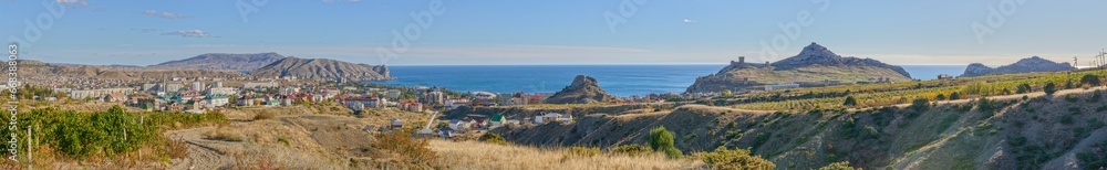 Panorama of Sudak location coastline with Genoese fortress, Crimea, Russia.