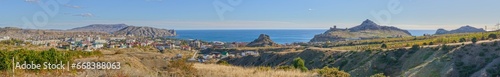 Panorama of Sudak location coastline with Genoese fortress, Crimea, Russia.
