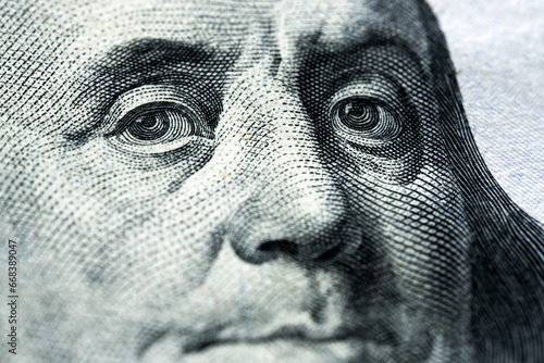Portrait of Benjamin Franklin on one hundred dollars banknote © Ievgen Skrypko