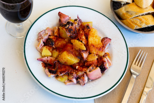 Galician-style octopus, tradicional Spanish dish, served on plate