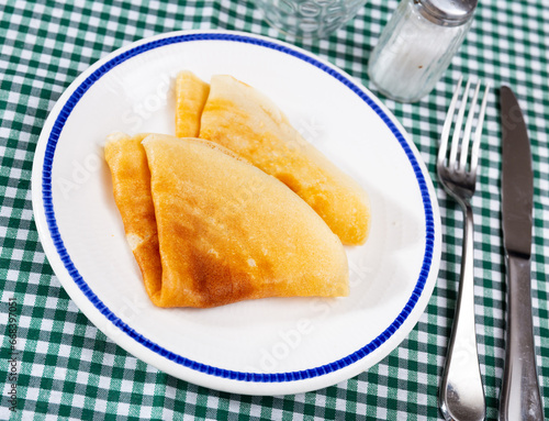 Traditional Hungarian palacsinta, paper-thin folded pancakes with minced meat filling. Popular savory appetizer..