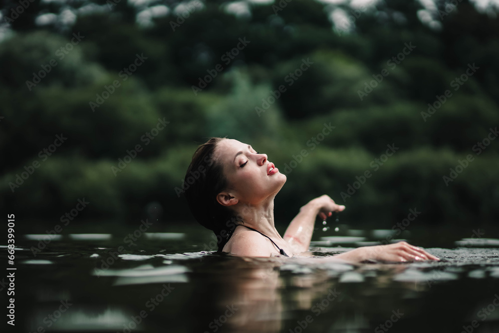 beautiful woman swims in the water of a lake river, swimming lessons. - obrazy, fototapety, plakaty 