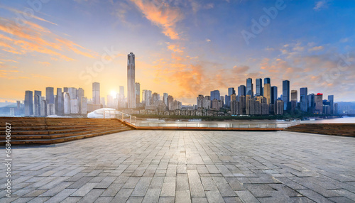 city square and skyline with modern buildings in chongqing at sunrise china