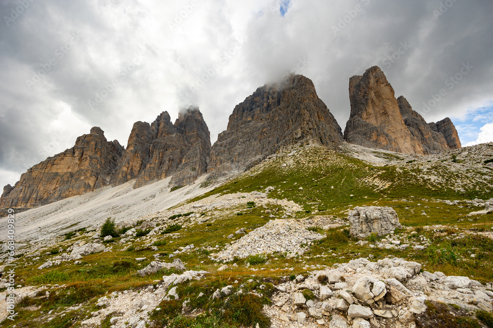 Fototapeta premium Breathtaking scenery featuring rocky mountain peaks on sunny summer day. Enchanting nature of Dolomites, Italy..